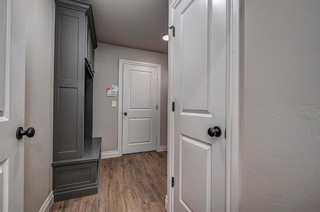 2001 W Crossbow Way, Mustang, OK 73065 - corridor with baseboards and wood finished floors