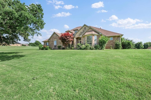 5420 NE 56th St, Oklahoma City, OK 73121 - view of front of property featuring a front yard and brick siding