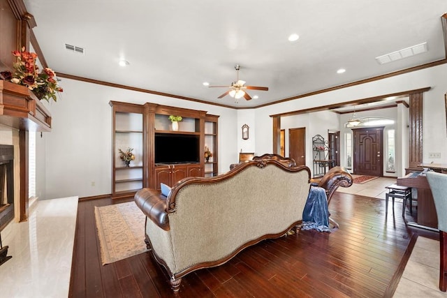 5420 NE 56th St, Oklahoma City, OK 73121 - living area featuring ceiling fan, crown molding, wood-type flooring, a fireplace with raised hearth, and recessed lighting