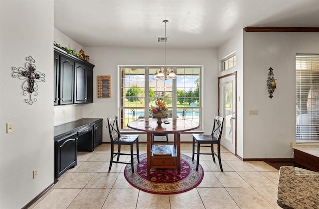 5420 NE 56th St, Oklahoma City, OK 73121 - dining space with light tile patterned floors and a chandelier