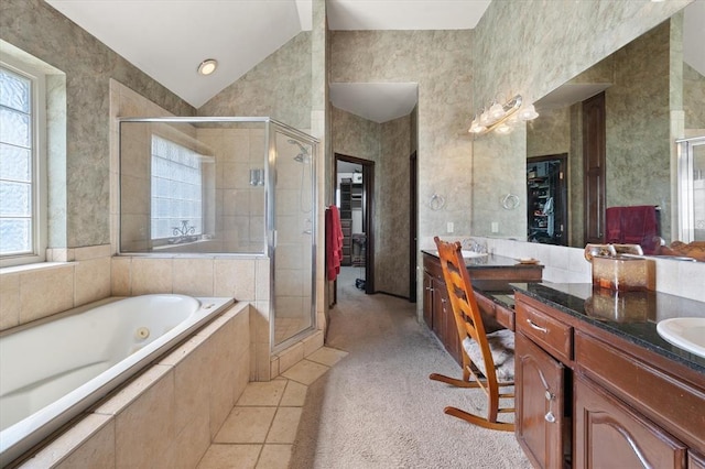 5420 NE 56th St, Oklahoma City, OK 73121 - bathroom with double vanity, a shower stall, a jetted tub, and vaulted ceiling