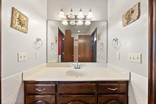 5420 NE 56th St, Oklahoma City, OK 73121 - bathroom with vanity and tile walls