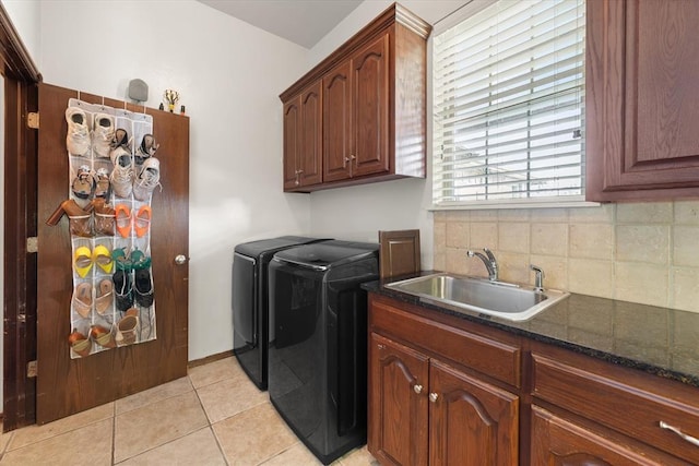 5420 NE 56th St, Oklahoma City, OK 73121 - laundry room with independent washer and dryer, light tile patterned flooring, and cabinet space