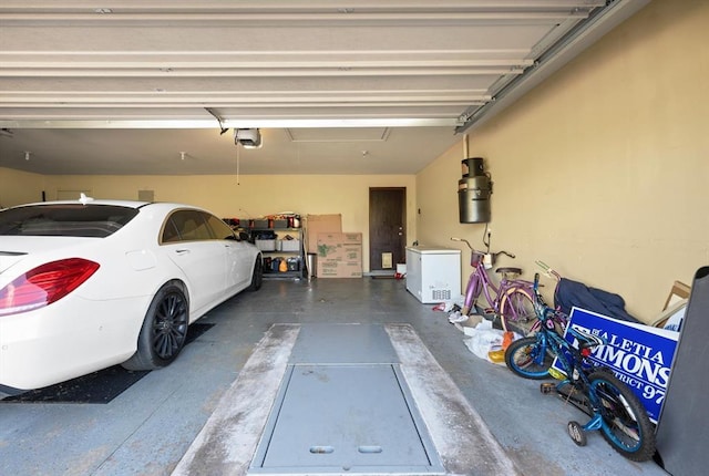 5420 NE 56th St, Oklahoma City, OK 73121 - garage with a garage door opener and fridge
