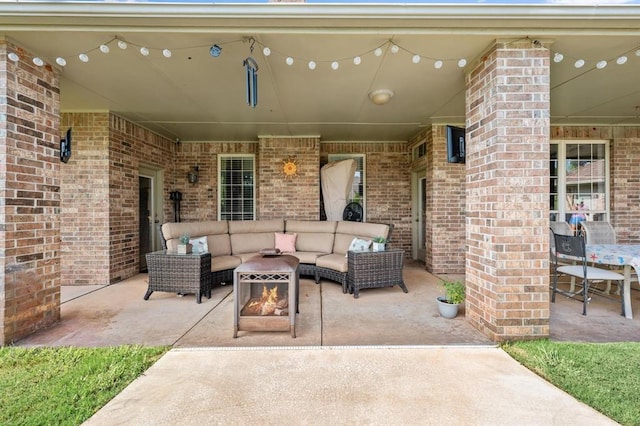 5420 NE 56th St, Oklahoma City, OK 73121 - view of patio with an outdoor living space with a fire pit