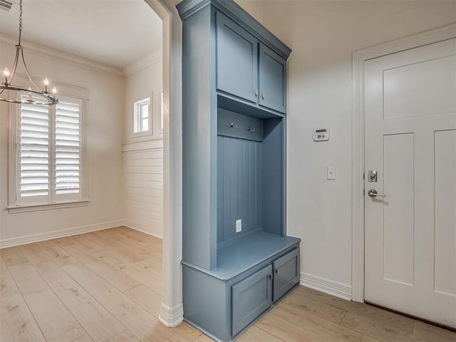 8408 NW 134th St, Oklahoma City, OK 73142 - mudroom with a chandelier, light wood finished floors, and crown molding