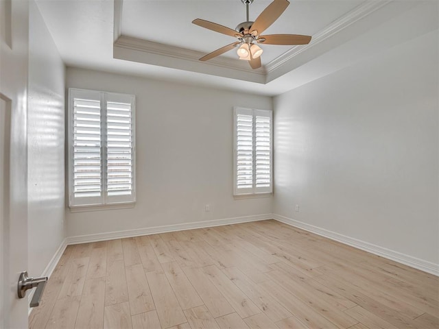 8408 NW 134th St, Oklahoma City, OK 73142 - spare room featuring a raised ceiling, ceiling fan, crown molding, hardwood / wood-style floors, and healthy amount of natural light