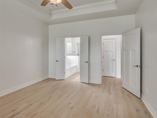 8408 NW 134th St, Oklahoma City, OK 73142 - unfurnished bedroom featuring a tray ceiling, light wood-style floors, ornamental molding, and ceiling fan