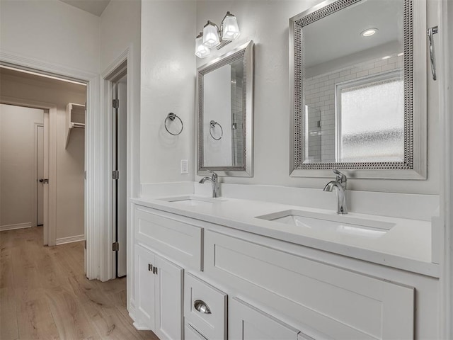 8408 NW 134th St, Oklahoma City, OK 73142 - bathroom with wood finished floors and double vanity