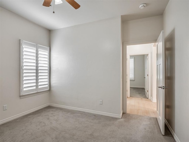 8408 NW 134th St, Oklahoma City, OK 73142 - carpeted spare room with a smoke detector and ceiling fan