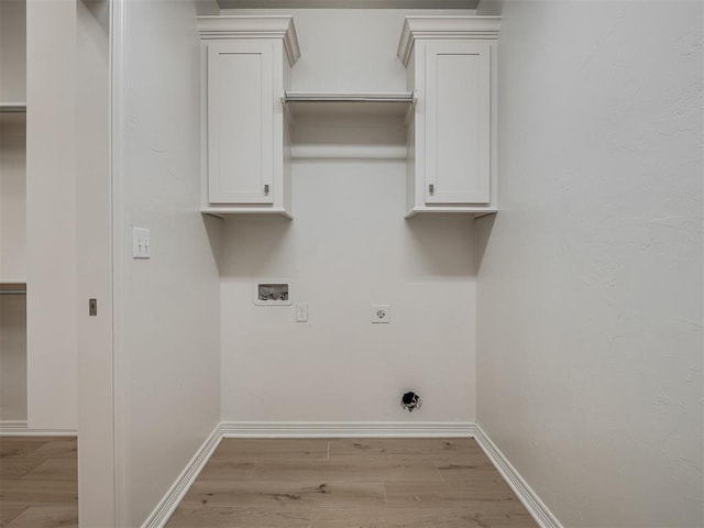 8408 NW 134th St, Oklahoma City, OK 73142 - washroom with hookup for an electric dryer, wood finished floors, and washer hookup