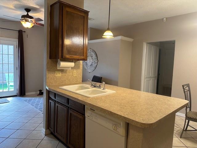 1208 SW 21st St, Oklahoma City, OK 73170 - kitchen featuring dishwasher, light tile patterned floors, a ceiling fan, light countertops, and a peninsula