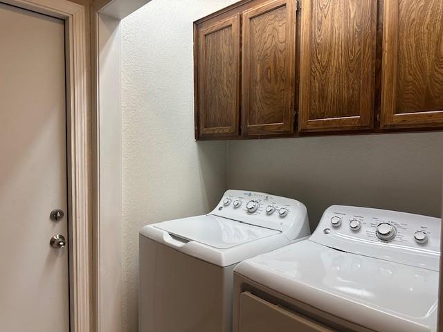 1208 SW 21st St, Oklahoma City, OK 73170 - washroom with separate washer and dryer and cabinet space