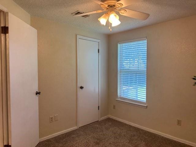 1208 SW 21st St, Oklahoma City, OK 73170 - unfurnished bedroom featuring a textured ceiling, carpet flooring, and ceiling fan
