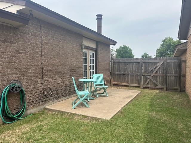 1208 SW 21st St, Oklahoma City, OK 73170 - view of yard featuring french doors and a patio