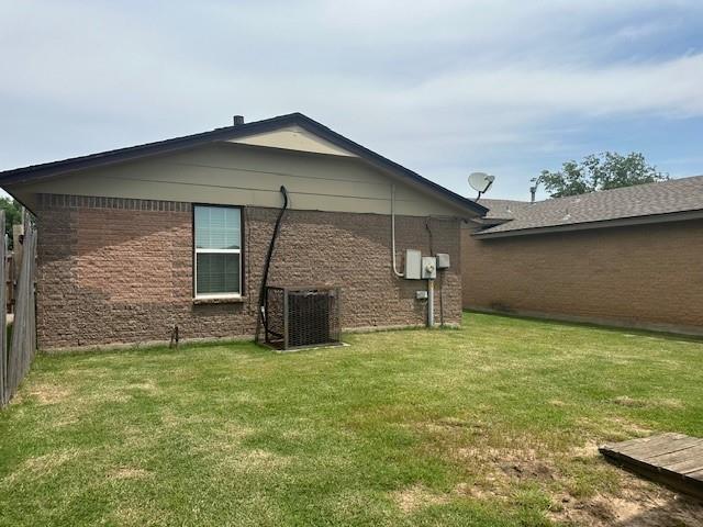 1208 SW 21st St, Oklahoma City, OK 73170 - view of property exterior featuring a cooling unit