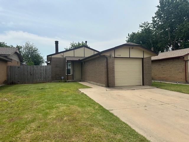 1208 SW 21st St, Oklahoma City, OK 73170 - view of front facade with brick siding, concrete driveway, and an attached garage