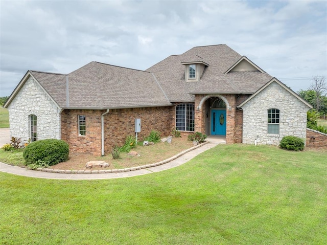 4120 S Choctaw Rd, Choctaw, OK 73020 - french provincial home featuring roof with shingles, a front yard, and stone siding