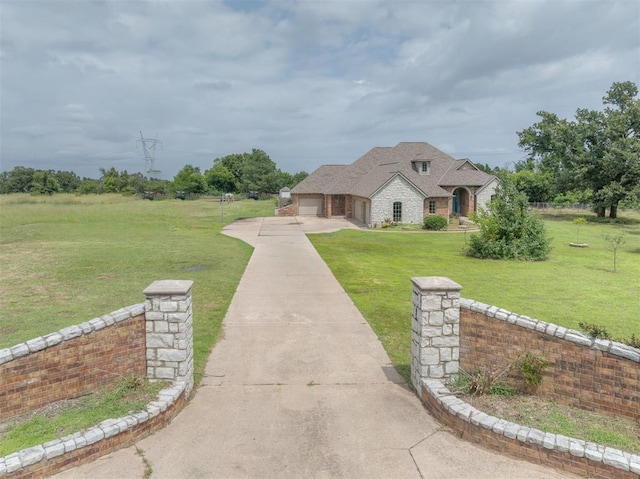 4120 S Choctaw Rd, Choctaw, OK 73020 - french country home with driveway, a front yard, and a garage