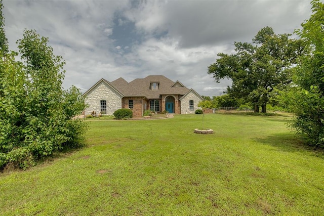 4120 S Choctaw Rd, Choctaw, OK 73020 - french country inspired facade with a front lawn, stone siding, and brick siding