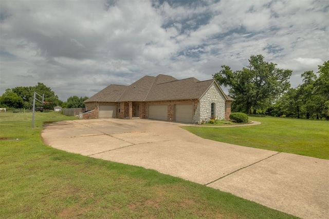 4120 S Choctaw Rd, Choctaw, OK 73020 - view of front of home featuring an attached garage, driveway, a front lawn, and stone siding
