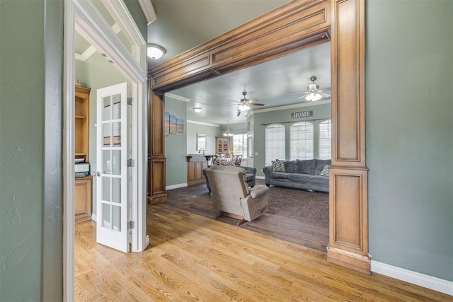 4120 S Choctaw Rd, Choctaw, OK 73020 - living room with crown molding, light wood-style flooring, and ceiling fan