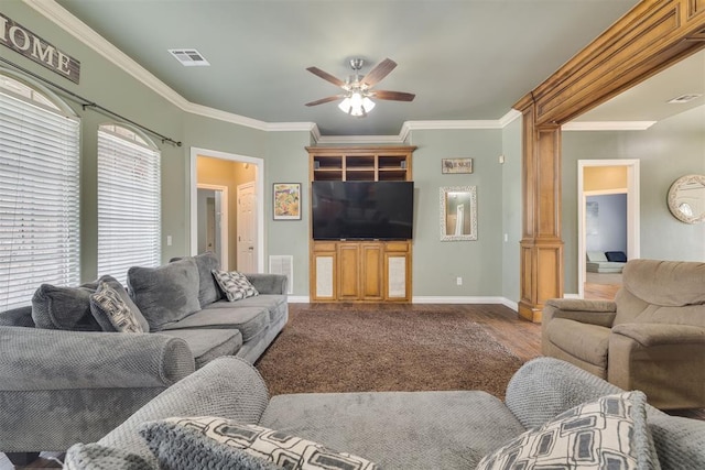 4120 S Choctaw Rd, Choctaw, OK 73020 - living room with a ceiling fan, wood finished floors, ornamental molding, and decorative columns