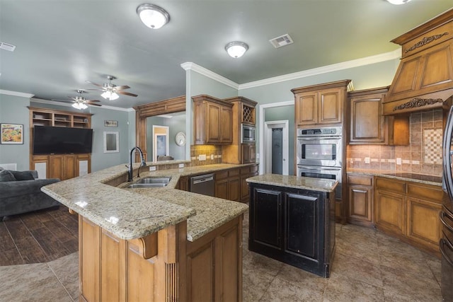 4120 S Choctaw Rd, Choctaw, OK 73020 - kitchen featuring appliances with stainless steel finishes, open floor plan, crown molding, tasteful backsplash, and light stone counters