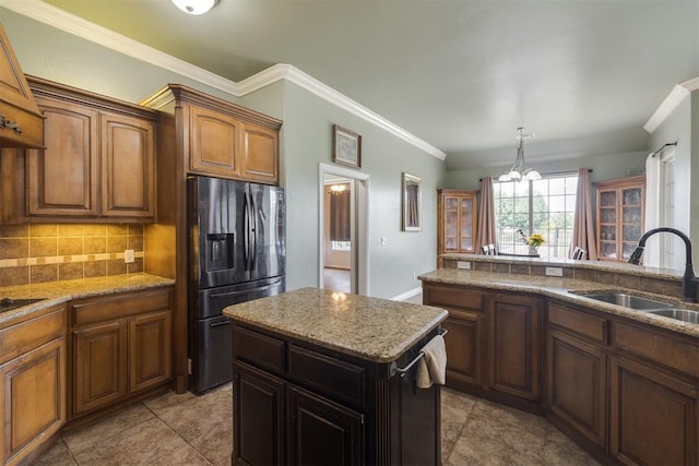 4120 S Choctaw Rd, Choctaw, OK 73020 - kitchen featuring stainless steel fridge, decorative backsplash, ornamental molding, light stone counters, and a chandelier