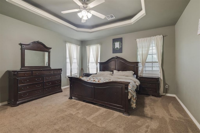 4120 S Choctaw Rd, Choctaw, OK 73020 - carpeted bedroom featuring a raised ceiling, multiple windows, and ceiling fan
