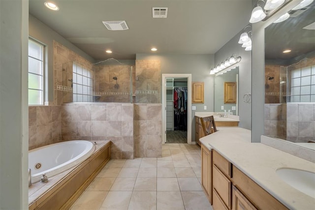 4120 S Choctaw Rd, Choctaw, OK 73020 - bathroom featuring a walk in shower, healthy amount of natural light, two vanities, and recessed lighting