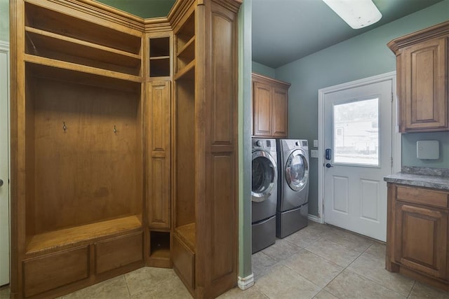 4120 S Choctaw Rd, Choctaw, OK 73020 - washroom with washer and clothes dryer, cabinet space, and light tile patterned flooring