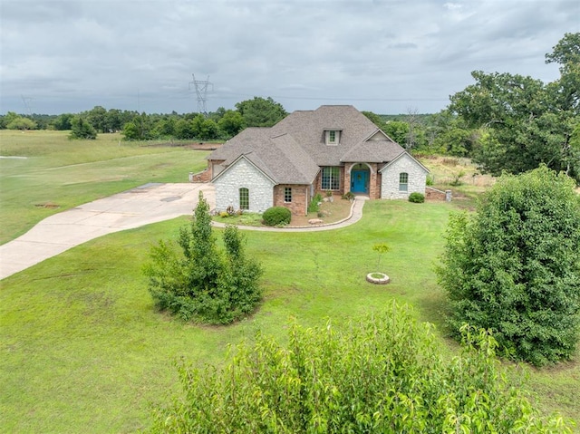 4120 S Choctaw Rd, Choctaw, OK 73020 - french provincial home with stone siding, a front lawn, brick siding, concrete driveway, and roof with shingles