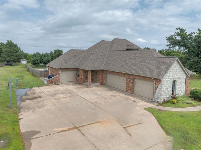 4120 S Choctaw Rd, Choctaw, OK 73020 - view of front of property featuring a garage, driveway, a shingled roof, and brick siding