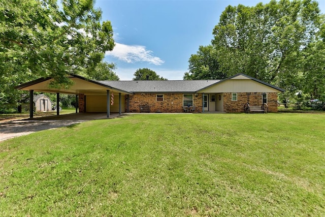 881 County St Unit 2938, Tuttle, OK 73089 - ranch-style home featuring driveway, a shed, a carport, an attached garage, and a front yard