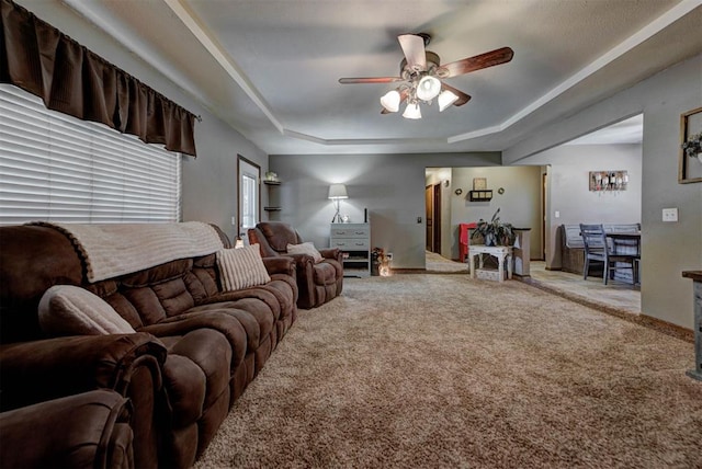 881 County St Unit 2938, Tuttle, OK 73089 - carpeted living room featuring a ceiling fan and a tray ceiling