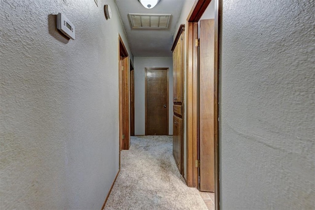 881 County St Unit 2938, Tuttle, OK 73089 - hallway featuring light carpet and a textured wall