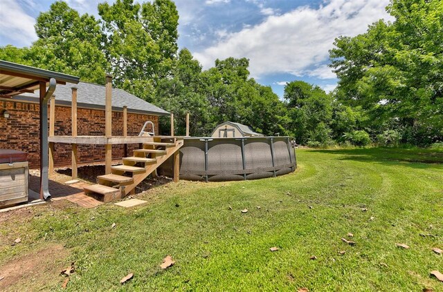 881 County St Unit 2938, Tuttle, OK 73089 - view of green lawn featuring view of scattered trees and a shed
