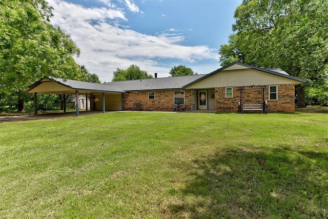 881 County St Unit 2938, Tuttle, OK 73089 - view of front of property with an attached carport, an attached garage, a front lawn, and brick siding