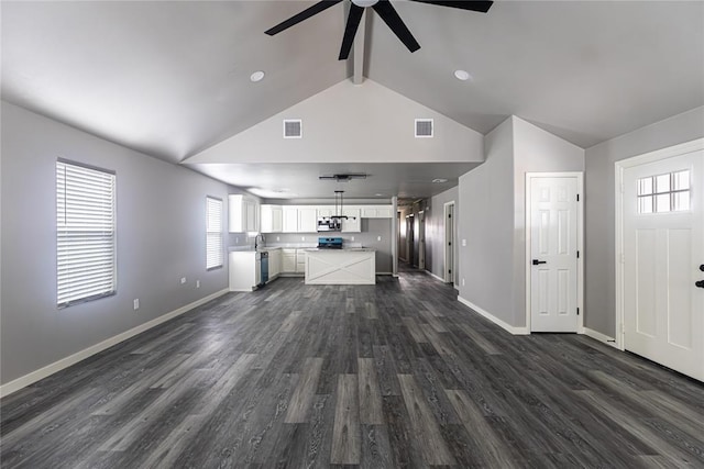 2824 SW 31st St, Oklahoma City, OK 73119 - unfurnished living room with ceiling fan, beam ceiling, dark wood-type flooring, and high vaulted ceiling