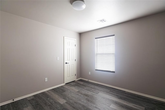 2824 SW 31st St, Oklahoma City, OK 73119 - unfurnished room with dark wood-type flooring and baseboards