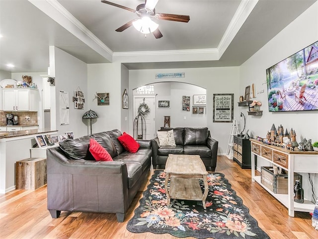 21945 N Fork Rd, Luther, OK 73054 - living area featuring ceiling fan, arched walkways, light wood-style floors, and crown molding