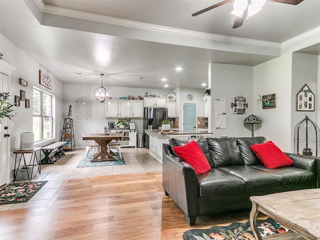 21945 N Fork Rd, Luther, OK 73054 - living area featuring a ceiling fan, light wood-type flooring, a chandelier, ornamental molding, and recessed lighting
