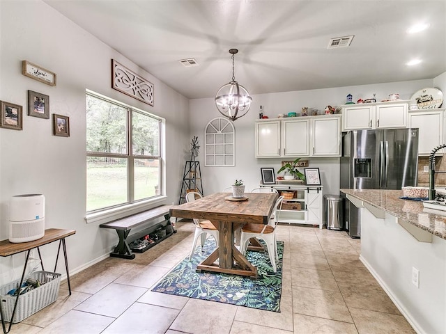 21945 N Fork Rd, Luther, OK 73054 - dining space featuring a chandelier and light tile patterned flooring