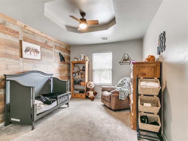 21945 N Fork Rd, Luther, OK 73054 - carpeted bedroom with wooden walls and ceiling fan