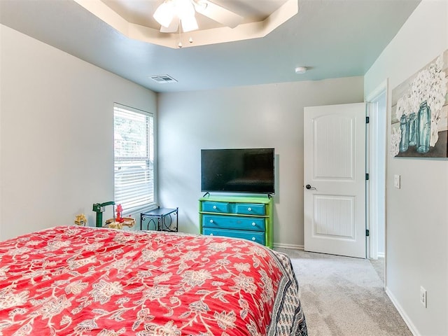 21945 N Fork Rd, Luther, OK 73054 - carpeted bedroom featuring a ceiling fan and a raised ceiling