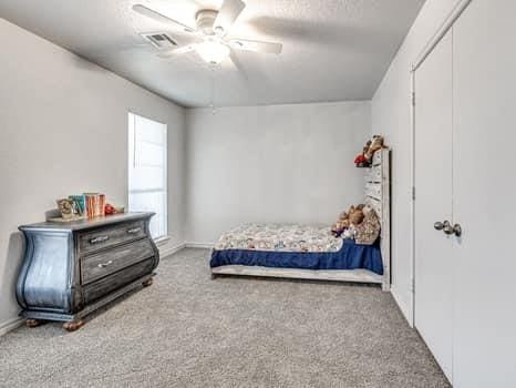 23 Lake Ln, Shawnee, OK 74804 - bedroom featuring carpet flooring and ceiling fan