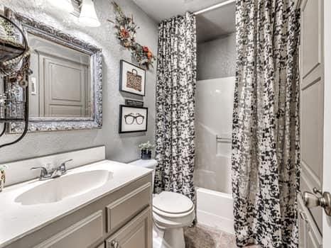 23 Lake Ln, Shawnee, OK 74804 - full bathroom featuring vanity and shower / bathtub combination with curtain