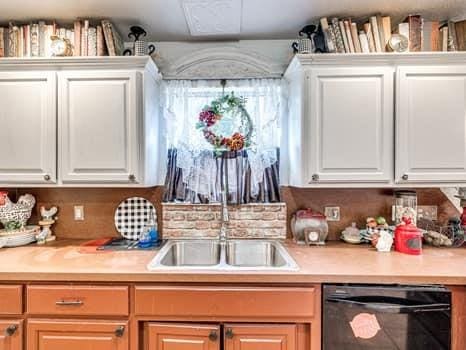 23 Lake Ln, Shawnee, OK 74804 - bar area with black dishwasher and a sink