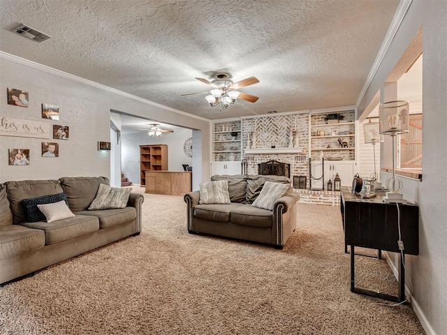 434 N Oak Ave, Hennessey, OK 73742 - carpeted living room featuring a ceiling fan, crown molding, a fireplace, a textured ceiling, and built in features